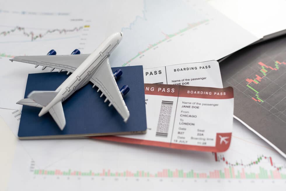 Boardwalk Resort Vacations Reviews illustrates airline reservation planning with a boarding pass, passport, and airplane model.